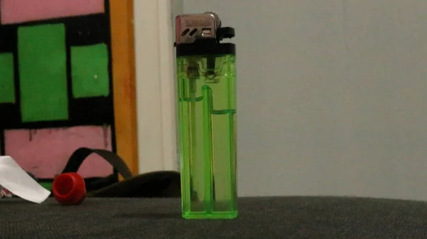 Green Lighter Black Table — Stock Photo, Image