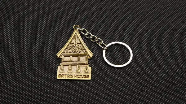 Traditional house key chain isolated on black background