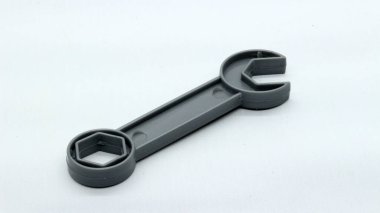 Plastic toy wrench isolated on white background