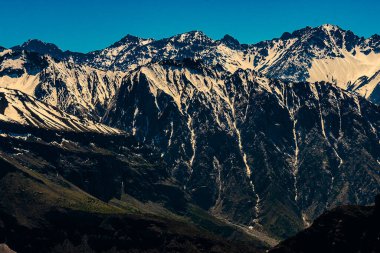 beautiful landscape of the snowy chilean andes in spring from the valley on a day with the sky blue and completely clear