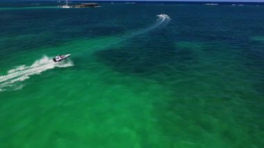 Luxurious yacht on blue azure lagoon around tropical islands in Dominican Republic, drone aerial view 4k