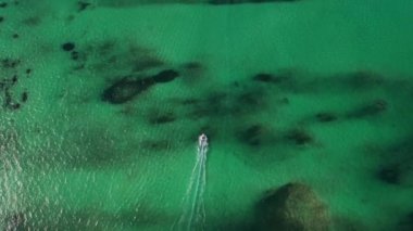 Luxurious yacht on blue azure lagoon around tropical islands in Dominican Republic, drone aerial view 4k