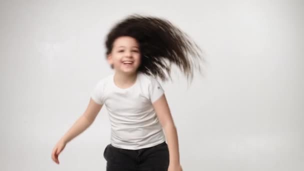 Little Charming Curly Girl Charming Smile Listens Music Wireless Headphones — Vídeos de Stock