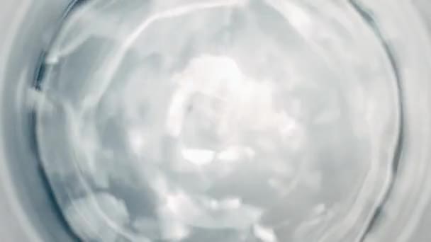 Pure Water Poured Glass Closeup Light Gray Background Super Slow — Vídeo de Stock