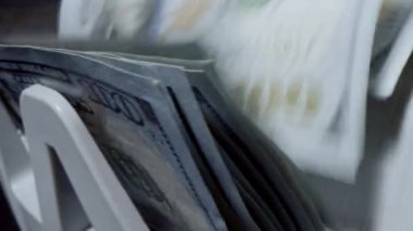 A counting machine for counting dollar bills. Banking and commercial activities. Quick cash loan. Bank automatic equipment for counting paper money. Close up cash counting equipment