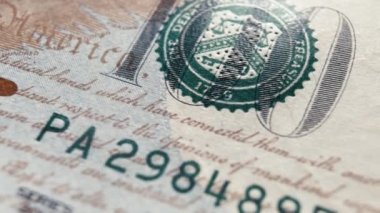 Close up detail of dollars bill. Extreme close up. Macro shot of US banknote. American dollar. Money cash. Financial concept. Numbers and signs on dollar bills. Currency. 4K footage
