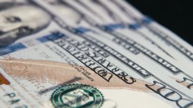 Close up detail of dollars bill. Extreme close up. Macro shot of US banknote. American dollar. Money cash. Financial concept. Numbers and signs on dollar bills. Currency. 4K footage