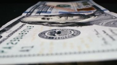 Close up detail of dollars bill. Extreme close up. Macro shot of US banknote. American dollar. Money cash. Financial concept. Numbers and signs on dollar bills. Currency. 4K footage