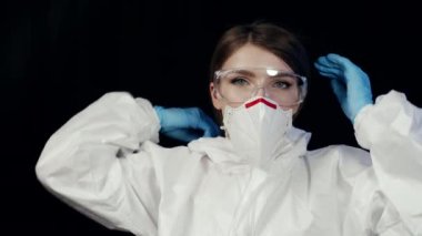 Close up female head, portrait woman doctor scientist nurse in white uniform transparent protective face shield prevention coronavirus covid infection posing in hospital laboratory looking at camera