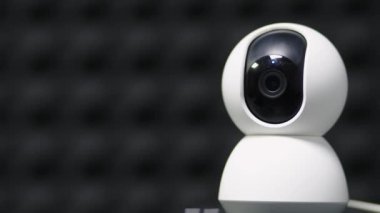 A surveillance camera takes a close-up video of the situation in a public place. Electronic devices for security and control. Recording equipment