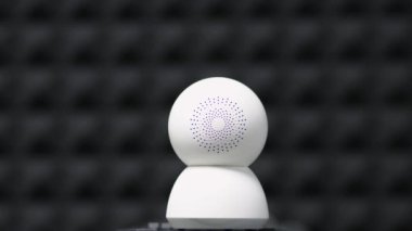 A surveillance camera takes a close-up video of the situation in a public place. Electronic devices for security and control. Recording equipment