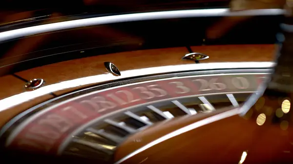 Roulette table in a casino with many games and slots, roulette wheel in the foreground. Golden and luxurious light, casino interior. Gambling is betting on money or gambling for money.
