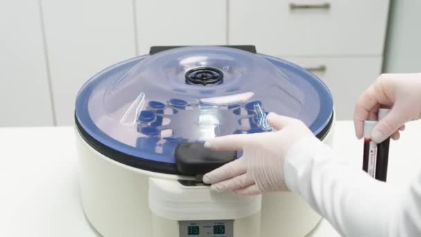 Close Chemist Using Centrifuge Lab Tubes Filled Blood Plasma Lifting — Stock Video