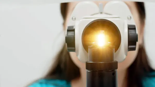 stock image Close-up view of an ophthalmologist examining a patient's eye. The concept of modern medical technologies, diagnostics and vision correction.