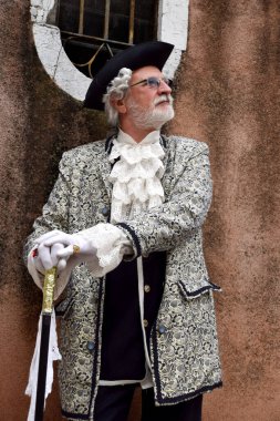 Old person dressed up for Carnival of Venice.