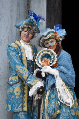 Couple of people dressed up for the Venice Carnival.