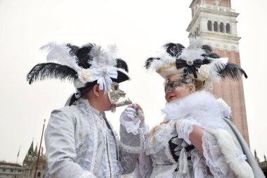 Couple of people dressed up for the Venice Carnival.