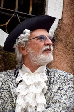 Old person dressed up for Carnival of Venice.