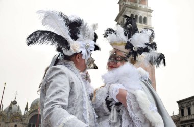 Couple of people dressed up for the Venice Carnival.