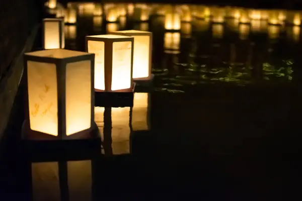 Image of Paper Lanterns on Water as Asian evening event for festivity and celebration
