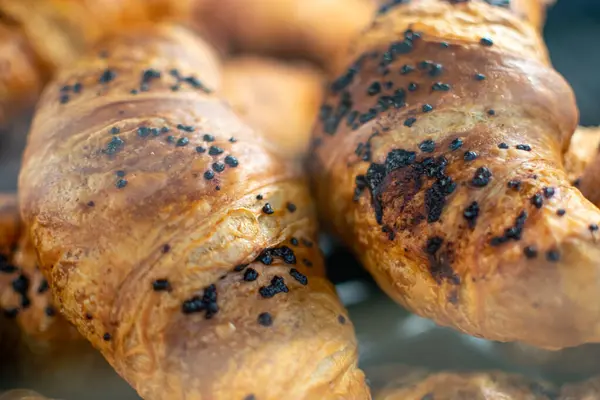 Image of Chocolate croissants stored for sale and consumption. Popular French pastries