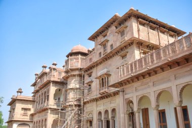 View of Junagarh Fort in Bikaner with havelis, windows and touristy red facades, India. clipart