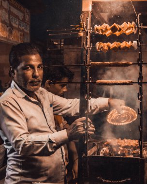 portrait of a young man in a leather jacket and gloves