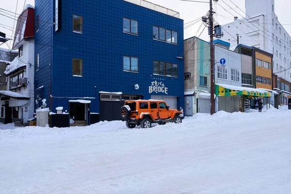 Hokkaido Japan December 2022 Stylish Orange Jeep Parked Snow Covered — Stock Photo, Image