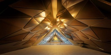 Modern geometrik şekilleri içeren çağdaş mimari tasarım, sıcak aydınlatma ve metalik yüzeylere sahip fütürist bir koridorda yenilikçi ve minimalist bir iç mekan yaratıyor.