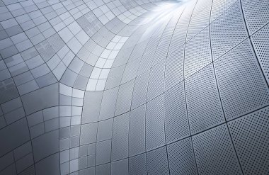 Metalik panellerle kıvrımlı bir cephe oluşturan mimari detay, modern tasarım ve inşaat tekniklerini vurguluyor