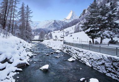 the snow covered the mountain lake, switzerland