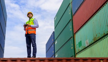 Warehouse engineer worker working at container yard. Logistics and Transportation. High quality photo