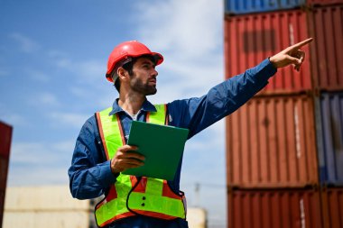 Warehouse engineer worker working at container yard. Logistics and Transportation. High quality photo