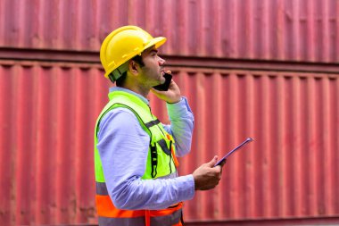 Warehouse engineer worker working at container yard. Logistics and Transportation. High quality photo