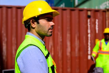 Warehouse engineer worker working at container yard. Logistics and Transportation. High quality photo