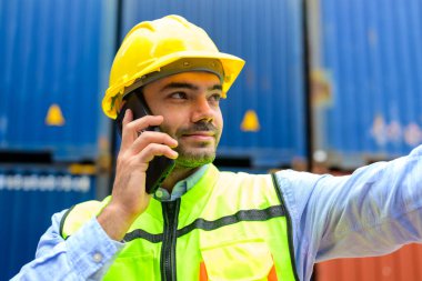 Warehouse engineer worker working at container yard. Logistics and Transportation. High quality photo