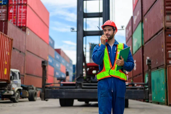 Warehouse engineer worker working at container yard. Logistics and Transportation. High quality photo