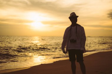 Happy Asian family travel together on beach on holiday. Family with beach travel. People enjoying with holiday vacation. High quality photo