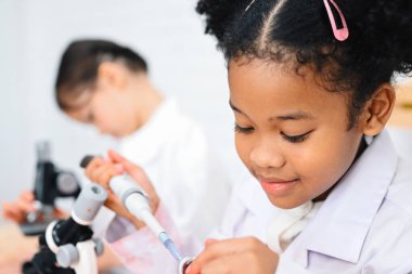 Back to school, Kids education knowledge, Child in classroom at school, Kid dressed Science lab coat. Science concept