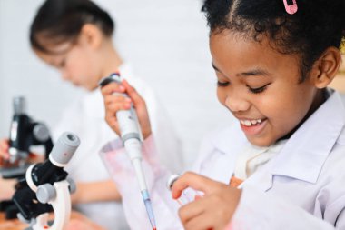 Back to school, Kids education knowledge, Child in classroom at school, Kid dressed Science lab coat. Science concept