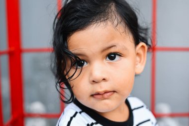 Smiling portrait of cute kid, Little boy playing at home, Happy child with toys
