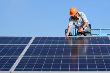 Solar panel station, Engineer worker installing solar panel at solar energy farm field, Alternative energy