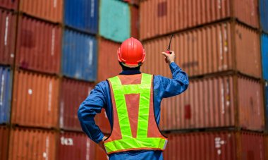 Warehouse engineer worker working at container yard. Logistics and transportation. High quality photo