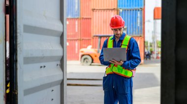 Warehouse engineer worker working at container yard. Logistics and transportation. High quality photo