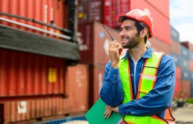 Warehouse engineer worker working at container yard. Logistics and transportation. High quality photo