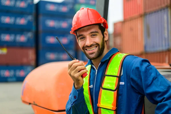 Warehouse engineer worker working at container yard. Logistics and transportation. High quality photo