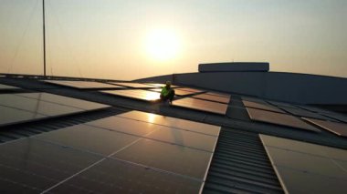 Solar cell farm power plant and solar panels with sunset in evening, Solar energy with warm sky, Clean energy, Alternative energy