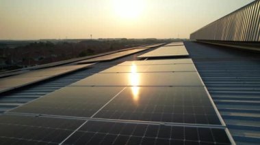 Solar cell farm power plant and solar panels with sunset in evening, Solar energy with warm sky, Clean energy, Alternative energy