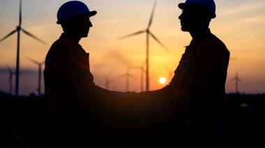 Professional engineer technician working outdoor at wind turbine field, Environmental engineer researching and developing clean energy sources, Green ecological power energy generation wind