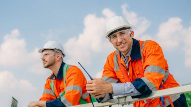 Professional engineer technician working outdoor at wind turbine field, Environmental engineer researching and developing clean energy sources, Green ecological power energy generation wind